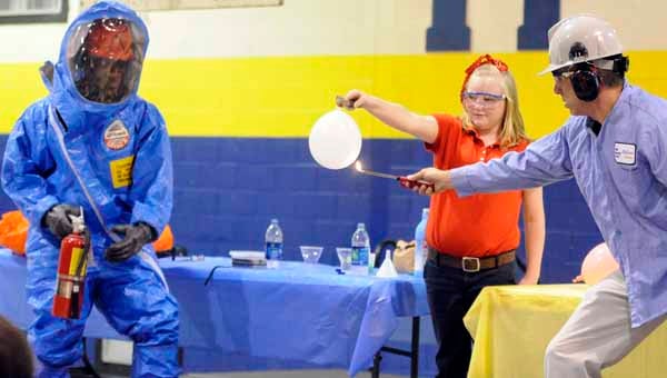 McKenzie School fourth grader MiKayla Blackburn takes part in an experiment during a demonstration by representatives from Saudi Basic Industries Corporation. Along with conducting experiments, SABIC also donated $3,000 worth of lab equipment and materials to McKenzie School. (Advocate Staff/Jonathan Bryant)