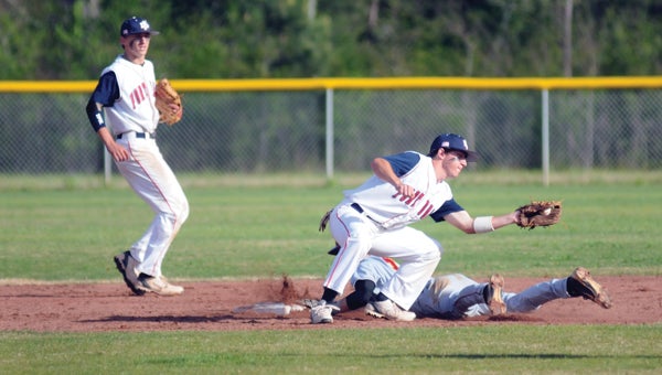 Fort Dale Academy second baseman Dylan Jones attempts to put the tag on an Escambia Academy base runner during the Eagles' 2-1 loss on Friday. (Advocate Staff/Andy Brown)