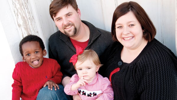 Tim and Lindsey Croley have served as foster parents for nearly four years. During that time they have opened their home to approximately 15 children, including Andrew (left), whom they adopted last year. Pictured are Tim, Lindsey, Andrew and Cates Croley. (Photo Courtesy of Ashley Paul Photography)