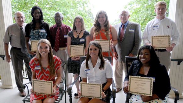 The Butler County Farmers Federation awarded seven scholarships to county students on Wednesday. Pictured are, seated from left to right, AJ Sanford, Taylor Merry and Brittany Blankenship.