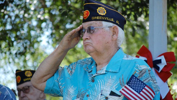 Wayne Killough, a Vietnam War veteran, salutes as the National Anthem is played during the 8th annual Greenville Lions Club Memorial Day Celebration at Confederate Park in downtown Greenville. The Lions Club will hold its 9th annual celebration at the park on Monday. Live music will get underway in the park at 9:30 a.m., with the patriotic program set to begin at 10:30 a.m. (File Photo)