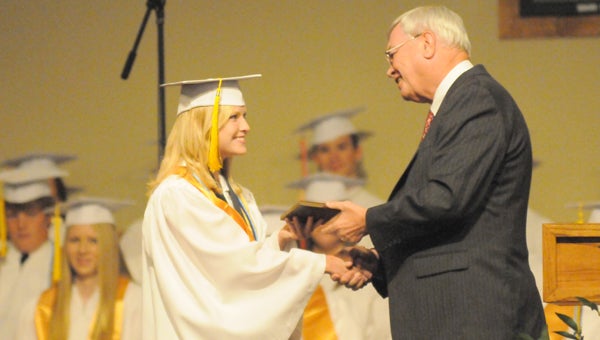 Fort Dale Academy headmaster David Brantley, pictured with 2013 valedictorian Christen McKeague, will be inducted into the Alabama Independent School Association Hall of Fame.