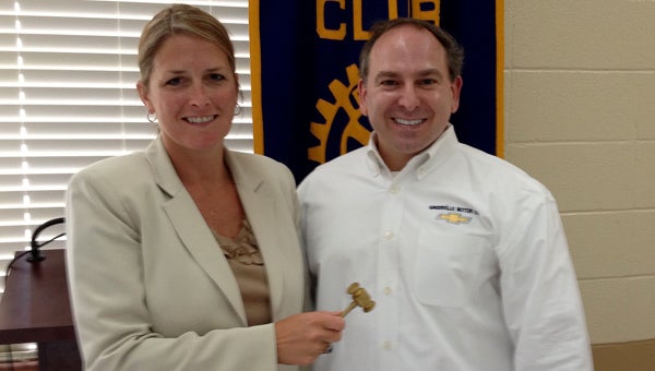 Rotary Club of Greenville President Charles Haigler III passed the gavel to incoming president Angie Rogers on Thursday. (Advocate Staff/Andy Brown)