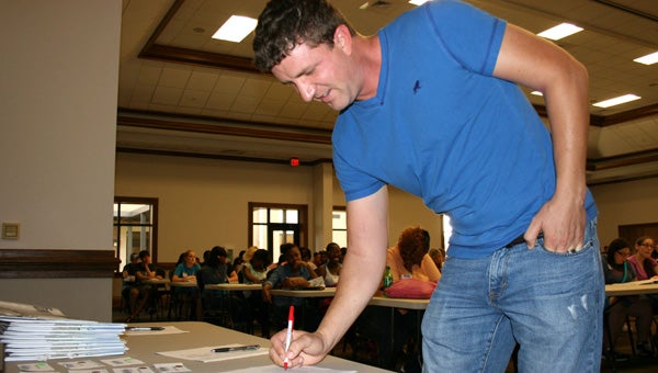 LBW Community College in Greenville recently welcomed a large crowd to orientation for new students. While on campus, students were introduced to several aspects of college life, toured the campus, met advisors and registered for classes. Pictured is Allen Grimes of Greenville, a finance and accounting major, as he signs in for the event. (Submitted Photo)