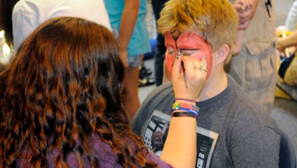 Montgomery’s Abrakadoodle Art Studios provided detailed face paintings of popular Star Wars characters, including fan favorites Darth Maul and Chewbacca during the Greenville-Butler County Public Library’s second annual Star Wars Day on Saturday. (Advocate Staff/Jonathan Bryant)