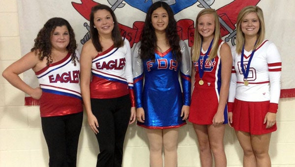 Fort Dale Academy recently had three members of its dance team and two members of its cheerleading squads chosen as All-Americans at their respective camps. By being named All-Americans, the dancers and cheerleaders qualify to participate in the Macy’s Thanksgiving Day Parade, Walt Disney World Thanksgiving Day Parade and London’s New Year’s Day Parade. Pictured are, from left to right, Caitlin Edgar and Jennifer Grace Arnold, junior varsity dancers; Lynn Choi, varsity dancer; Ashley Brogden, junior varsity cheerleader; and Hannah Johnson, varsity cheerleader. (Submitted Photo)