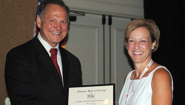 Circuit Judge Terri Bozeman Lovell received a 300-hour certificate from Alabama Chief Justice Roy S. Moore at the Judges Annual Continuing Education Training on July 17. (Submitted Photo)