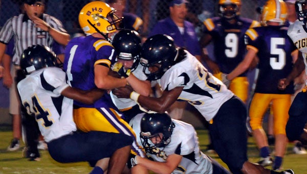 The McKenzie School defense swarms a J.U. Blacksher High School ball carrier Thursday night in a preseason game. The Tigers will travel to Highland Home Friday nigh to open the season. (Photo Courtesy of Bryan Campbell)