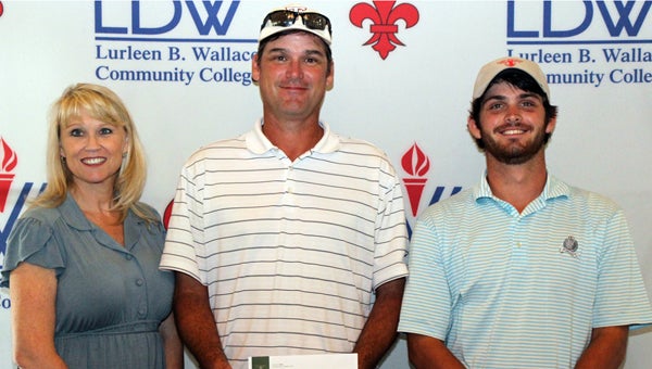 The LBW Community College Foundation recently held the annual LBWCC/Camellia City Classic Golf Tournament at Cambrian Ridge in Greenville to raise funds for student scholarships and activities. Dr. Arlene Davis, tournament coordinator, presented the first-place award to First Citizens Bank team of Todd and Cody Norman of Greenville. Other team members included Joby Norman of Greenville and Sam Starr of Andalusia, not pictured. (Courtesy photo)