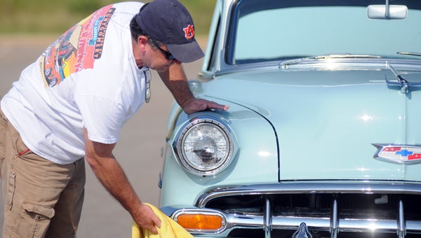 Steve Townes polishes his car during Saturday’s car show at The Edge. The car show was hosted by LifeLine Church. (Advocate Staff/Andy Brown)
