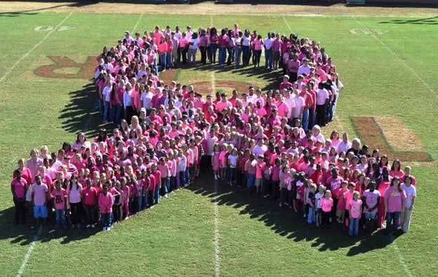 Students at Luverne School joined together to form this pink ribbon on Thursday. Students were encouraged to wear pink in honor of breast cancer awareness month. 
