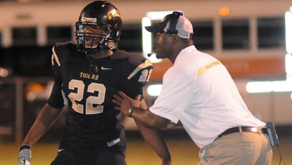 Greenville High School head coach Earnest Hill gives instructions to junior linebacker Mal Caldwell during Greenville’s game with Citronelle High School. The Tigers will take on Wilcox Central High School Thursday at 7 p.m. in Camden. (File Photo)