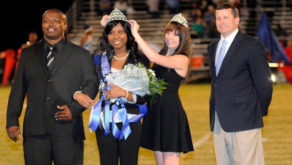 Tanya Walton was crowned Georgiana School homecoming queen Friday night prior to the start of the Panthers’ game with Red Level High School. Walton was escorted by Jamie Longmire and crowned by 2012 homecoming queen Tiffany Messer. Also pictured is Georgiana Principal Ward Thigpen. (Advocate Staff/Jonathan Bryant)