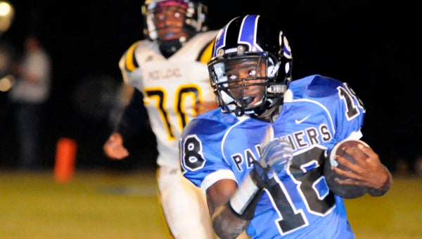 Georgiana School running Back Marvin Posey runs past a Red Level High School defender during the Panthers’ 48-6 win Friday night. (Advocate Staff/Jonathan Bryant)
