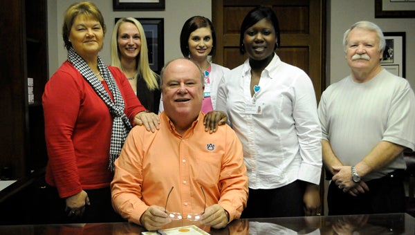 Greenville Mayor Dexter McLendon signed a proclamation Monday proclaiming November as National Hospice Month in the City of Greenville.  On hand for the signing were, from left to right, Southern Care Hospice staff members Joann Mathews, volunteer coordinator; Niki Bennet, community relations director; Ashley Pierce, RNCM; Karren Rogers, community relations manager; and Bro. Jim Wilson, chaplain. (Advocate Staff/Tracy Salter)