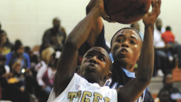 Greenville High School’s DaBryant Crenshaw scored 16 points to help power the Tigers to a 64-61, overtime victory against Calhoun High School Saturday night in Letohatchee. (File Photo)