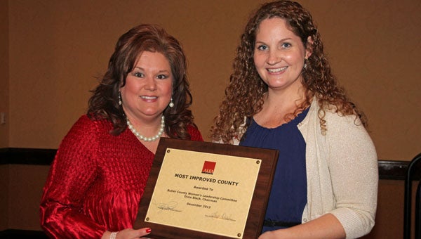 The Butler County Farmers Federation’s Women’s Leadership Committee was recognized as the “Most Improved County Committee” in the state during the Alabama Farmers Federation’s 92nd annual meeting in Montgomery Dec. 5-6. Committee chairman Dixie Black, right, accepted a recognition plaque from Federation Women’s Leadership Division Director Kim Ramsey, left, during an awards luncheon on Dec. 6. (Submitted Photo)