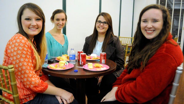 Sierra Teate, left, will take part in the state Distinguished Young Women competition Jan. 17-18 at Frazer Methodist Church in Montgomery. On Thursday, local DYW organizers held a send-off party for Teate at the Ritz Theatre. Pictured are, from left to right, Teate, Mollie Boutwell, Kristen Medley and Erica McNaughton. (Advocate Staff/Jonathan Bryant)