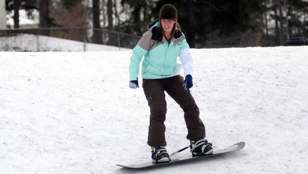 Jennifer Brown snowboards down a hill near her home in Greenville. (Advocate Staff/Andy Brown)