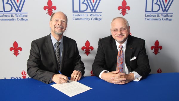 LBW Community College President Dr. Herb Riedel, left, and Auburn University at Montgomery Chancellor Dr. John G. Veres III recently signed a partnership agreement. (Courtesy Photo)