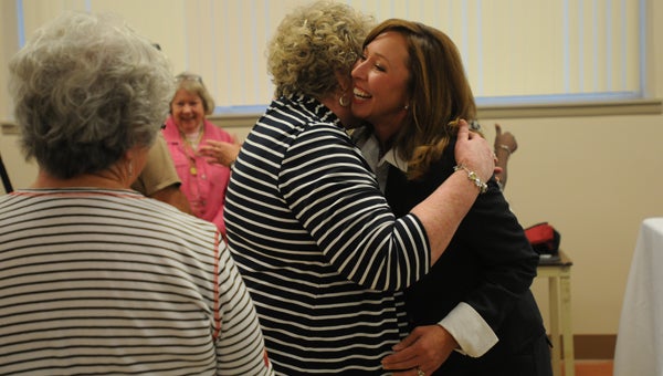 Amy Bryan, right, is congratulated on being named superintendent of the Butler County School System. The Butler County Board of Education voted unanimously on Thursday to appoint Bryan as superintendent. (Advocate Staff/Andy Brown)