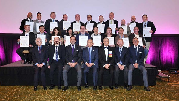 Dr. Robert L. Crosby (third row, fifth from the left) has earned fellowship status in the International Congress of Oral Implantologists. (Courtesy Photo)