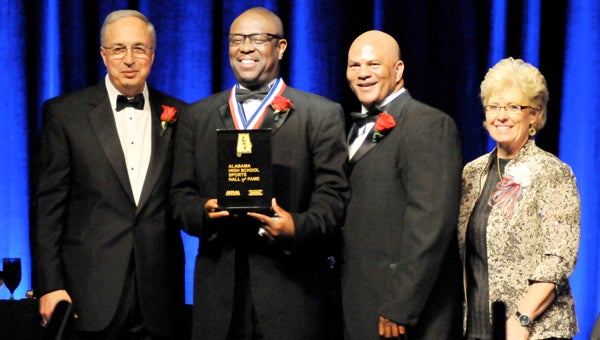 Former Lomax-Hannon head basketball coach Tony Stallworth was inducted into the Alabama High School Sports Hall of Fame Monday night. Pictured are, from left to right, AHSAA Executive Director Steve Savarese, Tony Stallworth, Avin Briggs and Myra Miles. (Photo by Andrew Garner/Andalusia Star-News)