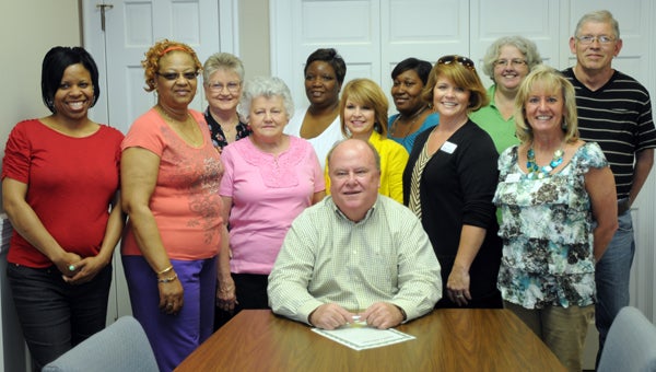 Greenville Mayor Dexter McLendon signed a proclamation Tuesday proclaiming April as Volunteer Appreciation Month in the City of Greenville. On hand for the signing were, front row, from left to right, Lilnetta Jones, Janet Lewis, Bernice Foster, Suanne Lewis, Comfort Care Hospice Volunteer Coordinator Rebecca Butts, and Comfort Care Hospice Clinical Nurse Liaison Charlene Clark. Back row, from left to right, Frances Arnould, Naomi Coleman, Tiffany Davis, Deena Wilson and Ray Boswell. (Advocate Staff/Andy Brown)