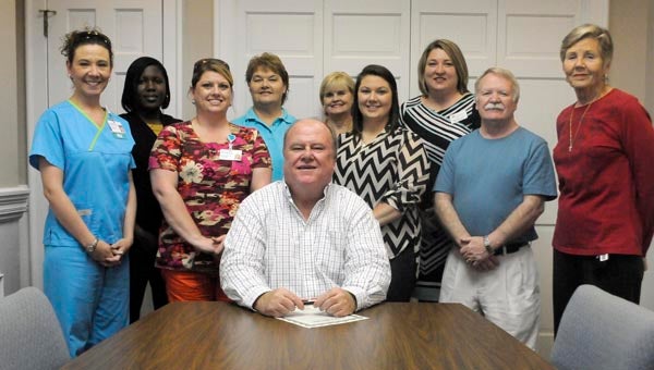 Greenville Mayor Dexter McLendon recently signed a proclamation proclaiming April as Volunteer Appreciation Month in the City of Greenville. On hand for the signing were, front row, from left to right, Monica Stringer, registered nurse; Heather Meeks, registered nurse; Holly Lowe, volunteer; Jim Wilson, chaplain; and Susan Murphy, volunteer. Back row, from left to right, Karren Rogers, community relations manager for Southern Care Hospice; Joann Mathews, volunteer coordinator Southern Care Hospice; Linda Hall, social worker; and Katie Thomas, volunteer. (Advocate Staff/Jonathan Bryant)