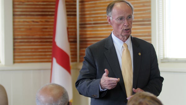 Gov. Robert Bentley talks with local small business owners Tuesday as part of his Road to Economic Recovery Tour. (Advocate Staff/Andy Brown) 