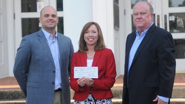 Southeast Alabama Gas District donated $7,683 to the Butler County School System on Thursday as part of its Give Back to Schools initiative. On hand for the presentation were, from left to right, Mitch Thorn, marketing representative for Southeast Alabama Gas District; Amy Bryan, Butler County Schools superintendent; and Mayor Dexter McLendon.  (Advocate Staff/Andy Brown)