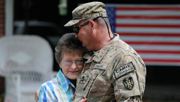 Longtime neighbor Evelyn Schofield welcomes MSG Ricky Beck home after a nine-month tour in Bagram, Afghanistan.