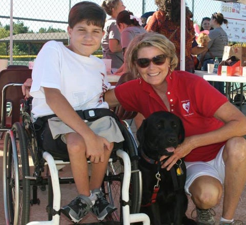 K-9s for Kids, a non-profit organization founded in 2008 by Greenville native Frances McGowin (right), pairs children with disabilities and special needs with service dogs, many of who were found living in animal shelters. On Sunday, the organization will hold a graduation ceremony in Montgomery for 10 dogs, which will be awarded to seven children with disabilities and three veterans with disabilities. (Submitted Photo) 