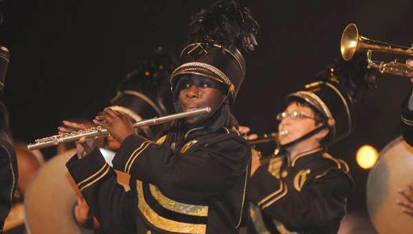 Members of Greenville High School’s Tiger Pride marching band perform during halftime of a game last season. This year, the band will be under the direction of Brett Johnson. The band’s halftime show will feature the music of R&B singer Bruno Mars. (File Photo)