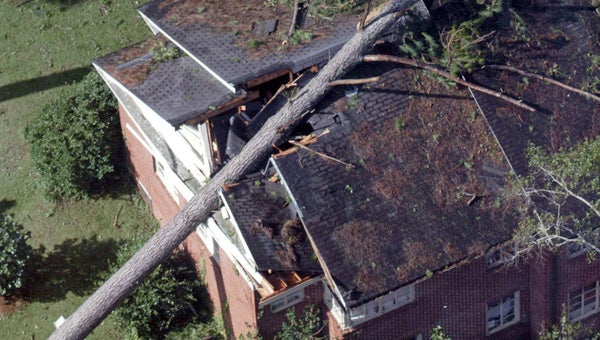 A home on Overlook Road in Greenville took a direct hit from a tree that was ripped from the ground by Hurrican Ivan. It’s been 10 years since Ivan unleashed its fury on the Gulf Coast. (File Photo)