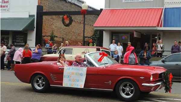 Mr. and Mrs. Ricky McGough are driven by Earl Dees in the Christmas Parade.  SUBMITTED PHOTO
