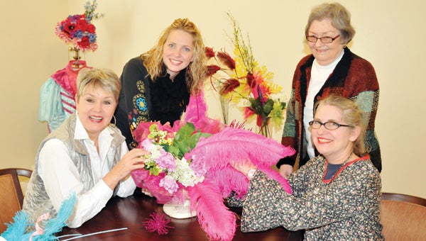 Shown from L to R: Nancy Idland, Alaina Norman, Marion Norman and Joni Thomas pose with one of the hats that the Country Place Senior Living residents are refurbishing. | ADVOCATE STAFF / ANDREW GARNER