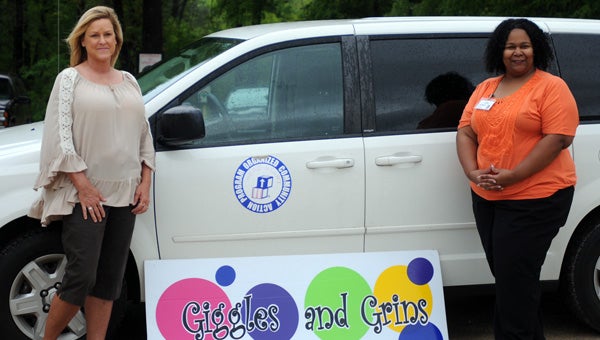 Kim Rogers, co-owner of Giggles and Grins, (left) and Harriet McFarland, Head Start director for Organized Community Action Program, (right) announced on Monday that the day care will begin providing Head Start services to area children. (Advocate Staff/Andy Brown)