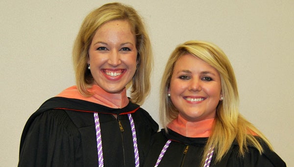 Greenville natives Lauren Bryan Smith, left, and Skyler Sherrell, right, were awarded their master of science in nursing degrees from Auburn University Sunday during a ceremony held in Auburn Arena.  (Submitted Photo)