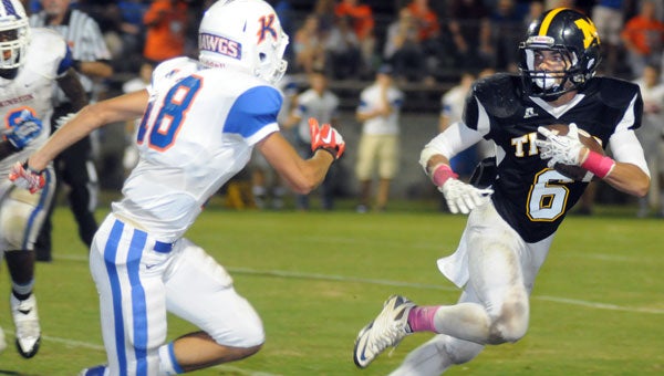 Star wide receiver Condie Pugh led the McKenzie Tigers to a 54-24 win over Kinston in 2014.