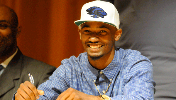 Former GHS standout defensive player Brian Barganier was all smiles Thursday as the athlete signed a letter of intent to play football for Jefferson State Community College.