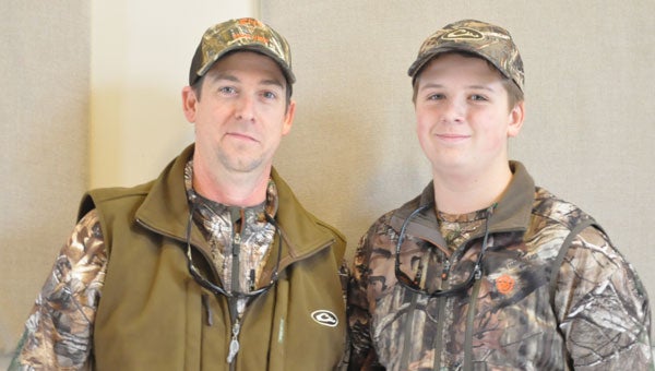 Trigg White (left) and his son Hayes (right) have travelled to the small town of Brantley for the past four years to participate in the school’s annual Letterman Hunt. Hunters from all across the country take the time to travel and hunt with the folks of Brantley and explore the woods of Alabama. (Photo by Beth Hyatt) 