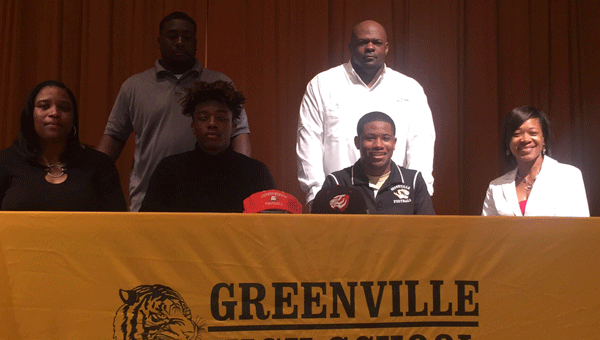 GHS seniors Ja’Quan Smith (seated second from the left) and Jaquaun Lewis (seated second from the right) signed scholarships to Carson-Newman University and the University of West Alabama respectively on National Signing Day.