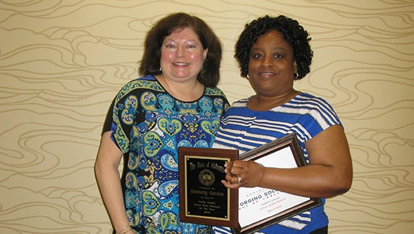 Alabama Department of Public Health Social Work Division Director Renae Carpenter, left, recognizes Kimberly Gordon as the Alabama Public Health Social Work Manager of the Year for 2016. (Submitted photo) 