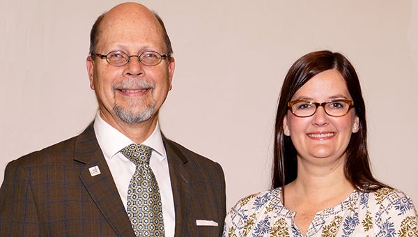LBW Community College President Dr. Herb Riedel, left, congratulates Christy Hutcheson, English faculty member, on her recent recognition at Auburn University. (Courtesy photo)