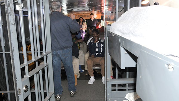 Greenville High School seniors got the chance Tuesday to step onto the Choice Bus, a half-prison cell, half-classroom converted school bus, which visually portrays two different life perspectives. The bus, created by The Mattie C. Stewart Foundation, is devoted to helping reduce the dropout rate in the United States. (Advocate Staff/Andy Brown)