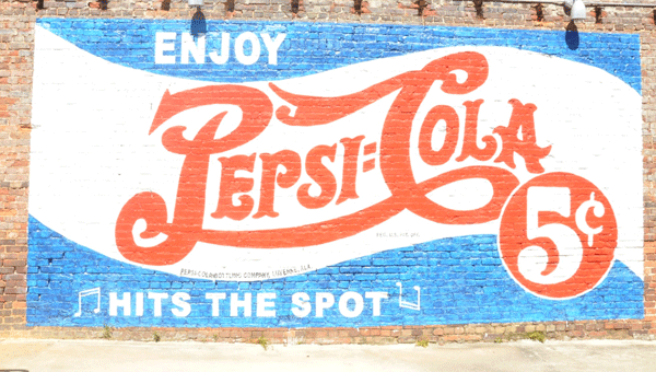 Pepsi-Cola Bottling Company of Luverne wanted to bring back the look and feel of older advertising methods by decorating the sides of a few building along the main street of Luverne. (Photos by Beth Hyatt) 