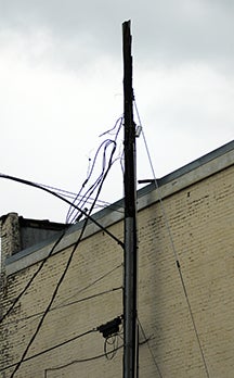 On Wednesday ightning struck a power pole next to Sears and severed the power lines from the pole. (Advocate Staff/Andy Brown)