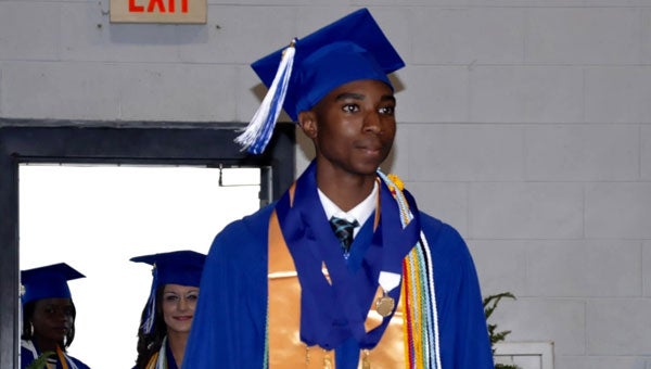 Valedictorian Darion Means heads to the stage in preparation for his upcoming speech. (Photo by Beth Hyatt)