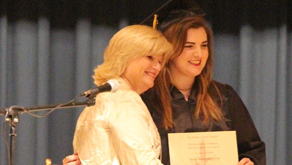 Greenville High School senior Mary Margaret LeCoq is awarded her scholarship from Vivian McGowin, Butler County Chapter scholarship representative. (Courtesy photo)